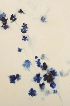 an abstract painting of blue flowers on a white background