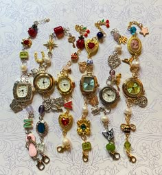 Watches pictured are from previous sales and, are not available. Watches made with glass and plastic beads, charms, and pearls. Charms are second hand, and individually sourced (not real gold or silver). All bracelets will be mixed metals (silver and gold). All watch faces are stainless steel. Watches With Pictures, Cheap Vintage Silver Watch Accessories, Cheap Vintage Watch Accessories For Women, Funky Watches For Women, Watch Face Jewelry, Watch Making Craft, Vintage Beaded Bracelets For Gift, Bracelet Stack Mixed Metals, Cute Bracelet Stacks