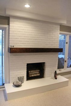 a white brick fireplace in a living room