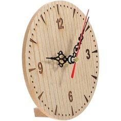 a wooden clock with red hands and numbers on the face is shown against a white background