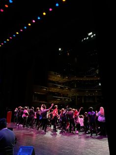 a group of people standing on top of a stage