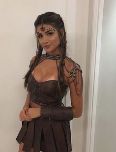 a woman with long hair wearing a corset and holding her hands on her hips