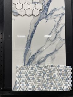 a marble tile display with hexagonal tiles