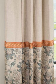 a curtain with an orange and blue border