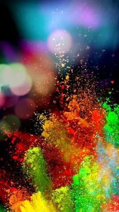 colorful powder is being thrown into the air