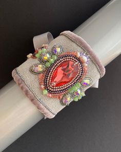 a close up of a bracelet on a white pole