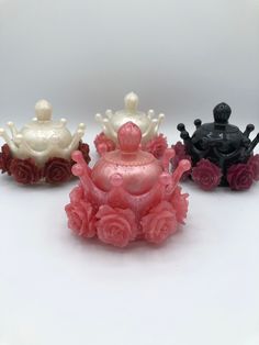 three small decorative items sitting on top of each other