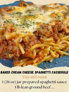 a blue plate topped with pasta covered in cheese and sauce next to a white background