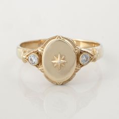 This vintage-style signet ring is a minimal North star, surrounded by other smaller stars and flush set diamonds on each side. The center star can be swapped out for your initial! CUSTOMIZATION AND FONTS * Usually script letters are preferred for this ring, but I can place any type of design or font. * This ring can be customized with any letter (provided it fits) and is made in solid gold. I recommend a single letter for this ring, as the oval is quite small. * This ring can be made for men or Luxury Vintage Signet Ring With Engraving Option, Star Signet Ring, Classic Polished Star Shaped Signet Ring, Celestial Signet Ring, Signet Rings Women Vintage, Celestial 14k Gold Signet Ring, Signet Ring Wax Seal, Elegant Star-shaped Signet Ring For Gift, Elegant 14k Gold Star-shaped Signet Ring