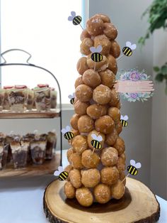 donuts stacked on top of each other with honeybees in the middle and bee decorations around them