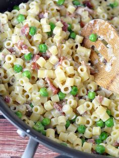 a skillet filled with pasta and peas