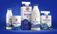 several different types of milk on a blue background