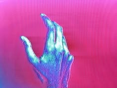 an image of a hand on a pink background