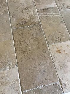 an image of a tile floor that looks like it has been cleaned and is dirty