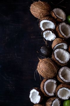 coconuts and limes are arranged on a black background with space for text or image