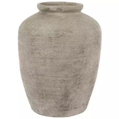 a large gray vase sitting on top of a white table