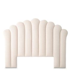 an upholstered headboard with five curved white foams on the top and bottom