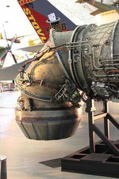 an airplane engine sitting on display in a museum