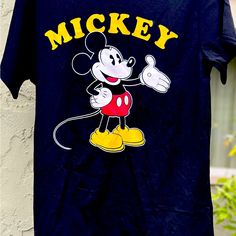 Going To Disney? This Shirt Is Awesome! New Without Tags Soft Classic Mickey Shirt Super Soft And Comfortable Mickey Mouse Crew Neck T-shirt For Disney Events, Black Mickey Mouse Shirt For Disney Fan Events, Disney Mickey Mouse T-shirt For Streetwear, Black Shirt With Character Print For Disney Fan Events, Black Pop Culture Top With Letter Print, Cute Mickey Mouse T-shirt For Fan Merchandise, Cute Mickey Mouse T-shirt For Fans, Cute Mickey Mouse T-shirt Fan Merchandise, Black Disney Short Sleeve Shirt