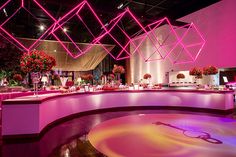 a very nice looking restaurant with pink lighting