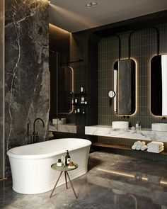 a bathroom with marble walls and flooring, including a bathtub in the center