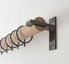 a wall mounted wine bottle rack with six corks