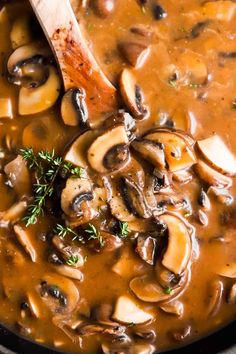 mushroom soup in a pot with a wooden spoon