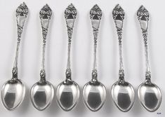 six spoons are lined up next to each other