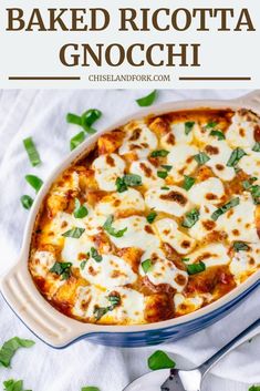 baked ricotta gnocchi in a casserole dish with basil and cheese