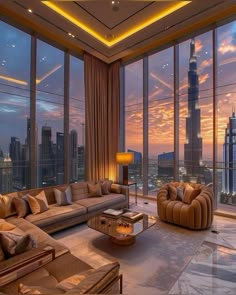 a living room filled with lots of furniture and tall buildings in the background at sunset