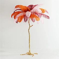 an orange and pink feathered tree on a white background