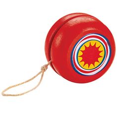 a red toy with a yellow and blue circle on it's end is tied to a rope