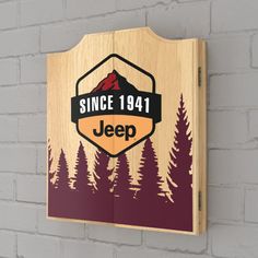 a wooden sign hanging on the side of a brick wall that says since 1971 jeep