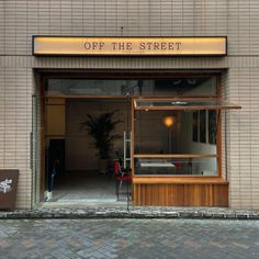 the entrance to an off the street restaurant