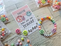 there are some candy beads on the table with cards and magnets around them that say make your own friends