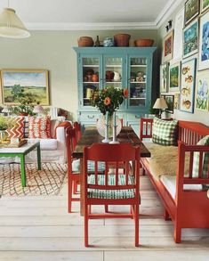 a living room filled with lots of furniture and pictures on the wall next to each other