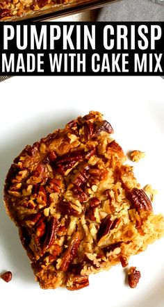 pumpkin crispy made with cake mix on a white plate and topped with pecans