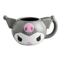 a gray and white mug with a pink skull on it's face, sitting in front of a white background