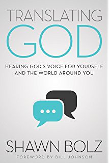 a book cover with an image of two speech bubbles and the words, translating god