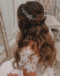 the back of a woman's head wearing a bridal hair comb