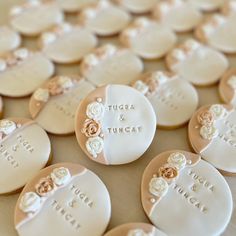 wedding cookies with names and flowers on them