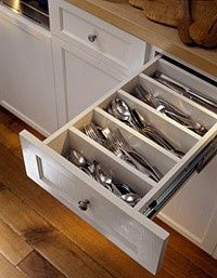 an open drawer with silverware in it and the words make so much more sense, and looks infinitely better than those plastic dividers