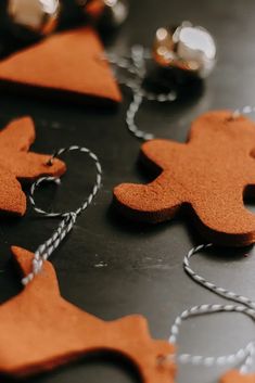 some orange felt ornaments are on a table