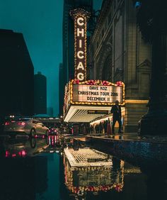 the chicago theatre marquee is lit up at night