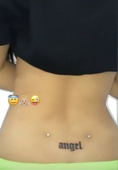 a woman's stomach with the word angel written on it and emoticions