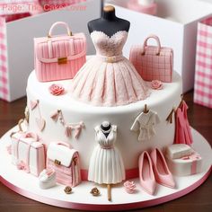 there is a cake that has pink and white designs on it, including purses