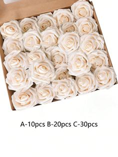 a box filled with lots of white roses