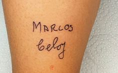 a person with a tattoo on their leg that says marco belly