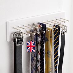 a rack with ties hanging from it's sides and an union jack tie hanger