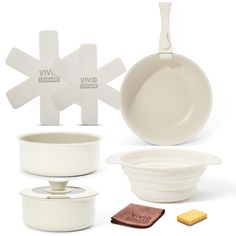 various white dishes and utensils are shown in front of a card board with the word vivi on it